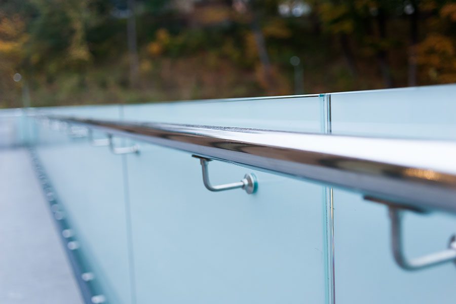 Frosted glass balustrade with floating stainless steel handrail