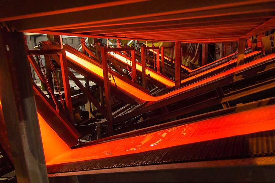 Molten glass being cooled in large sheets