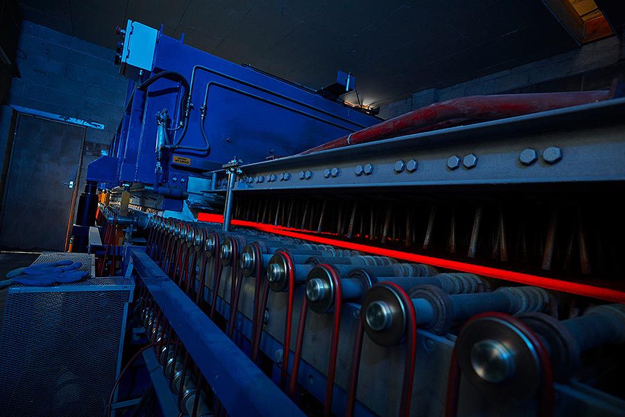 glass sheet being put through a toughening machine