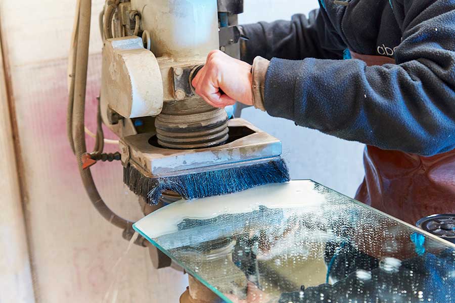 Hand bevelling and polishing glass at abc Glass Processing