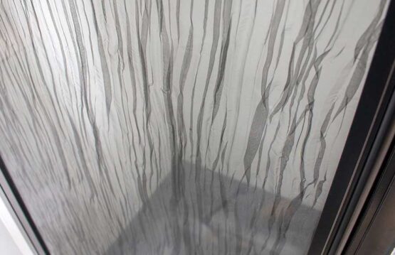 Decorative laminated glass shower door
