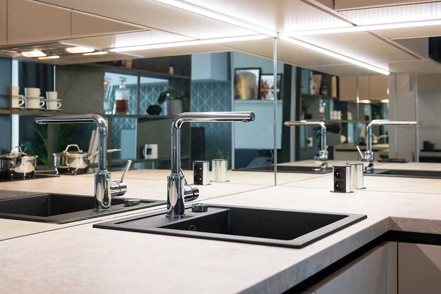 mirrors used as a splashback in a kitchen rather than tiles