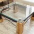 Square glass top table with wooden legs