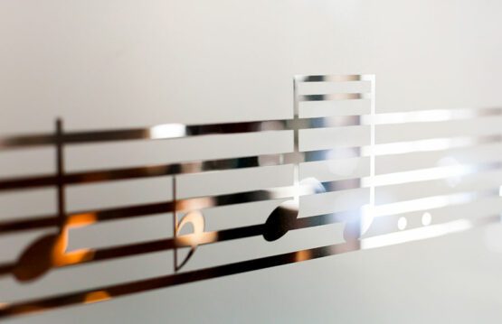 Musical notes etched onto the surface of a piece of glass