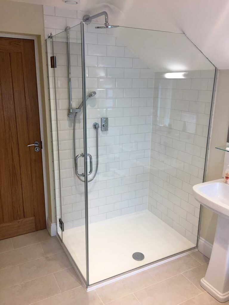 Large bespoke frameless corner shower enclosure with hinged door