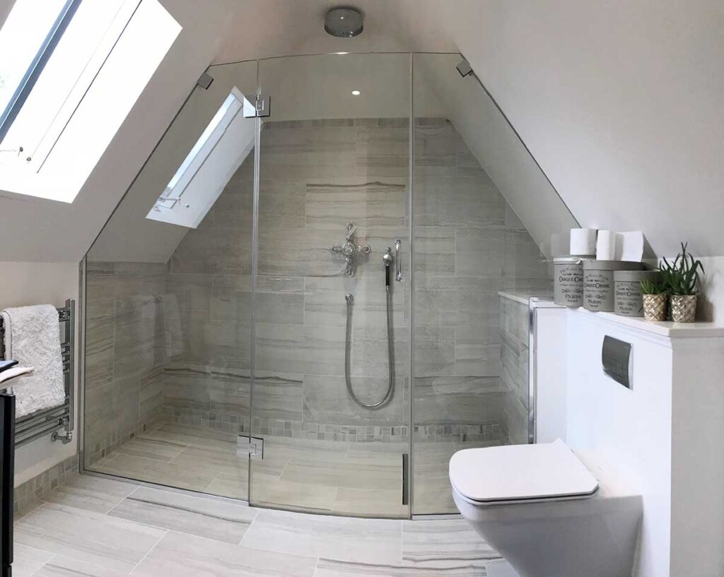 Large bespoke loft shower enclosure shaped to fit two sloping ceilings